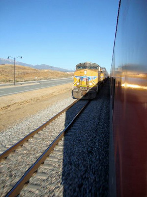 A westbound Union Pacific freight train passes Amtrak's eastbound Sunset Limited near Redlands, CA on Oct. 25, 2011. Photo by Malcolm Kenton.